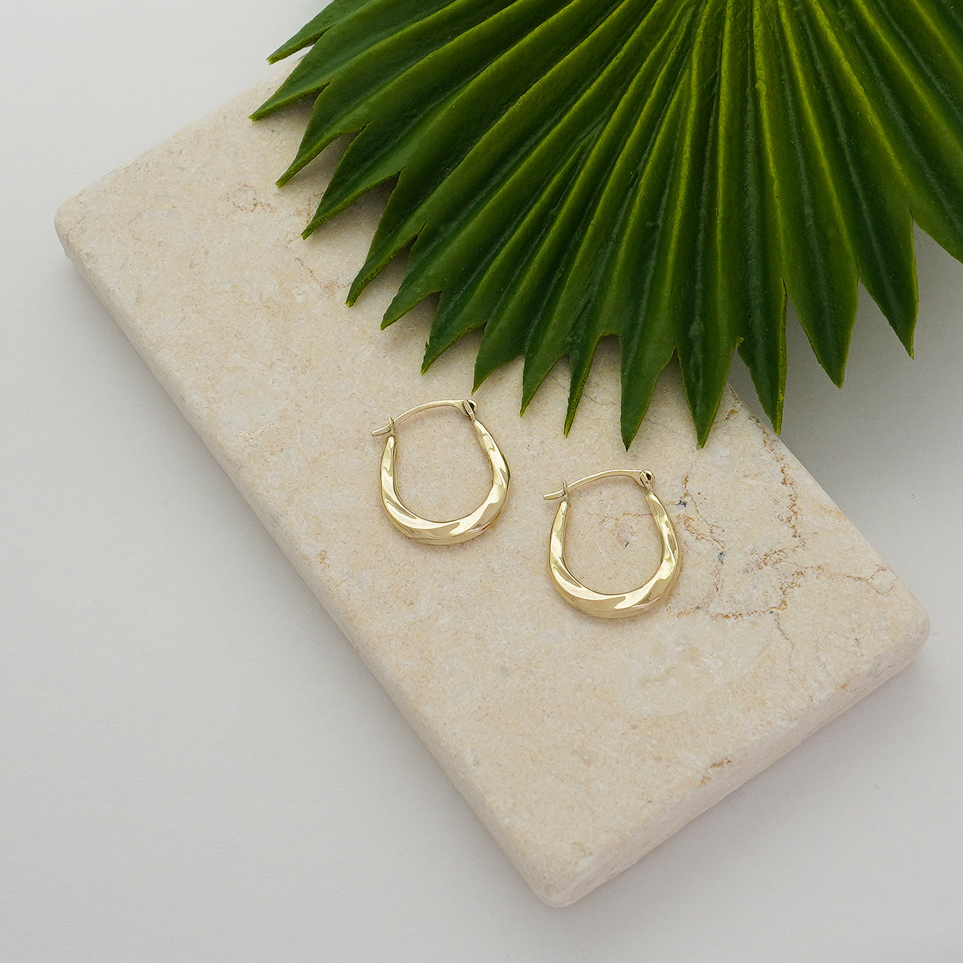Solid Gold Twist Design Oval Shape Hoop Earrings